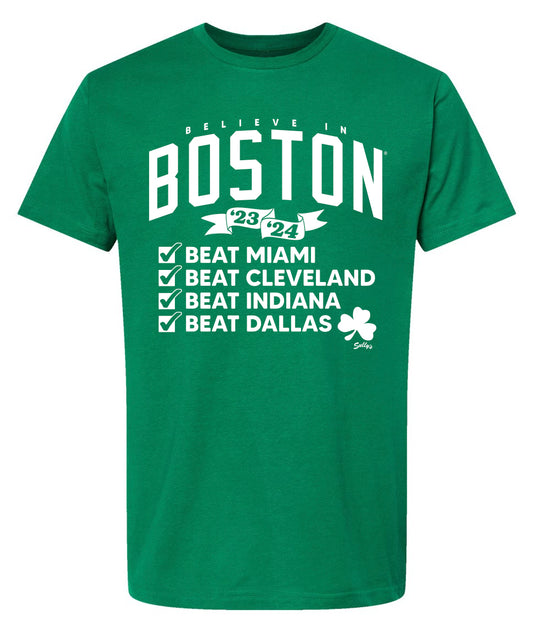 Green t-shirt that says Believe in Boston 23-24. Checkboxes that say Beat Miami, Beat Cleveland, Beat Indiana, Beat Dallas. With a shamrock in white font.