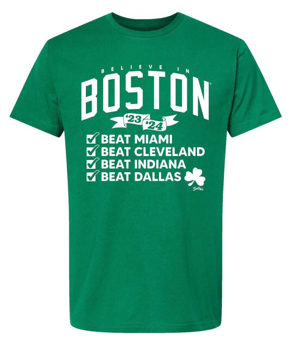 Green t-shirt that says Believe in Boston 23-24. Checkboxes that say Beat Miami, Beat Cleveland, Beat Indiana, Beat Dallas. With a shamrock in white font. 